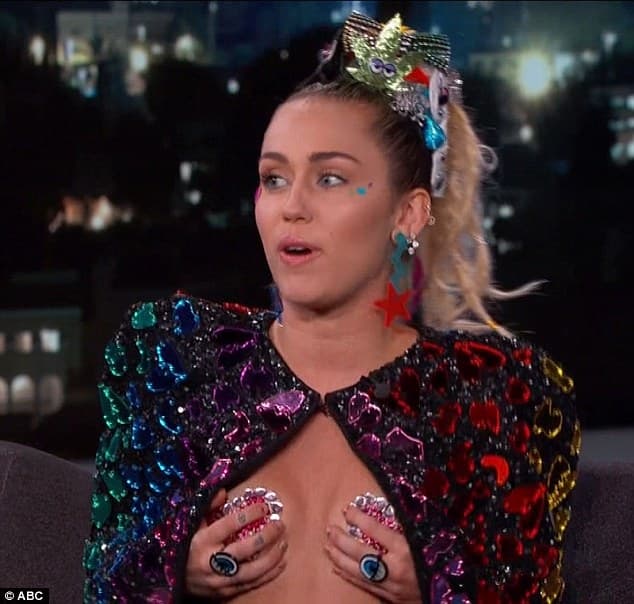 Miley Cyrus wearing pink heart- shaped pasties